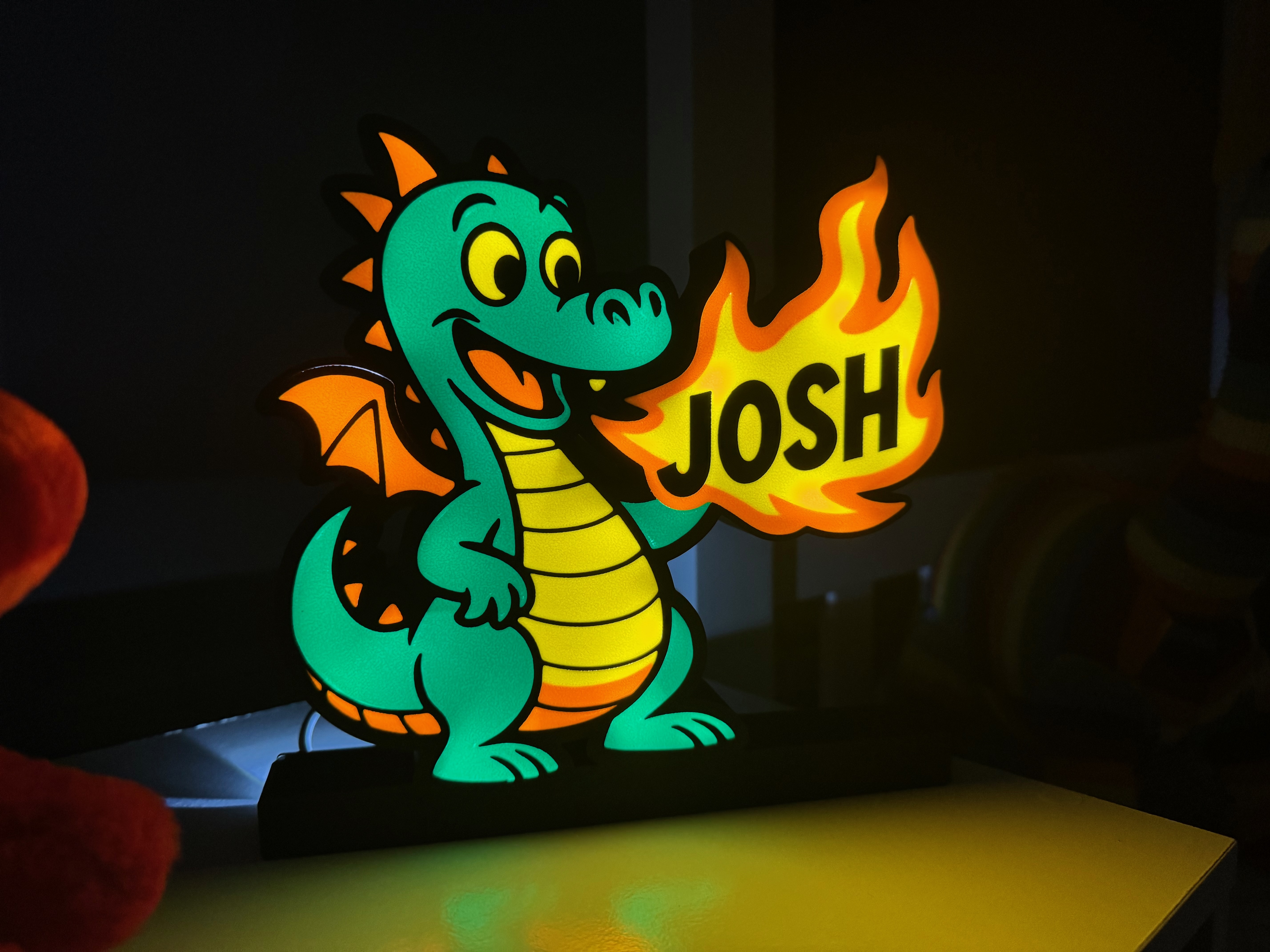 Children’s themed light box featuring dinosaurs and diggers