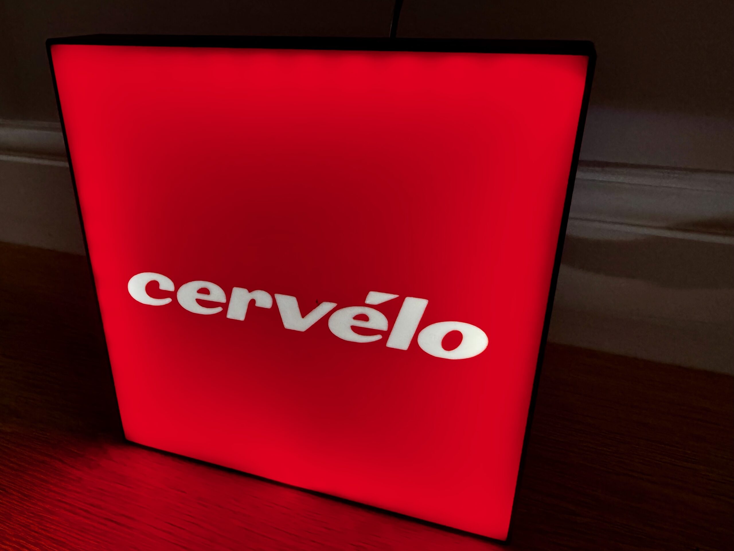Illuminated red Cervélo light box glowing with bold logo