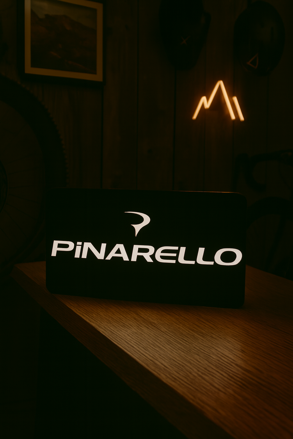 Pinarello illuminated light box glowing in cycling-themed room