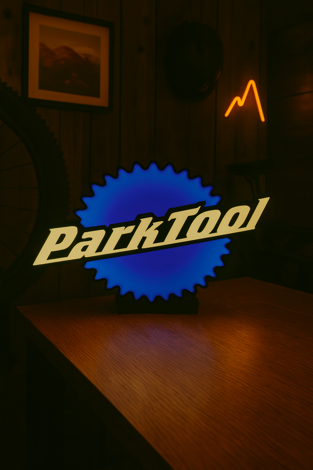 Illuminated Park Tool light box glowing blue and white logo