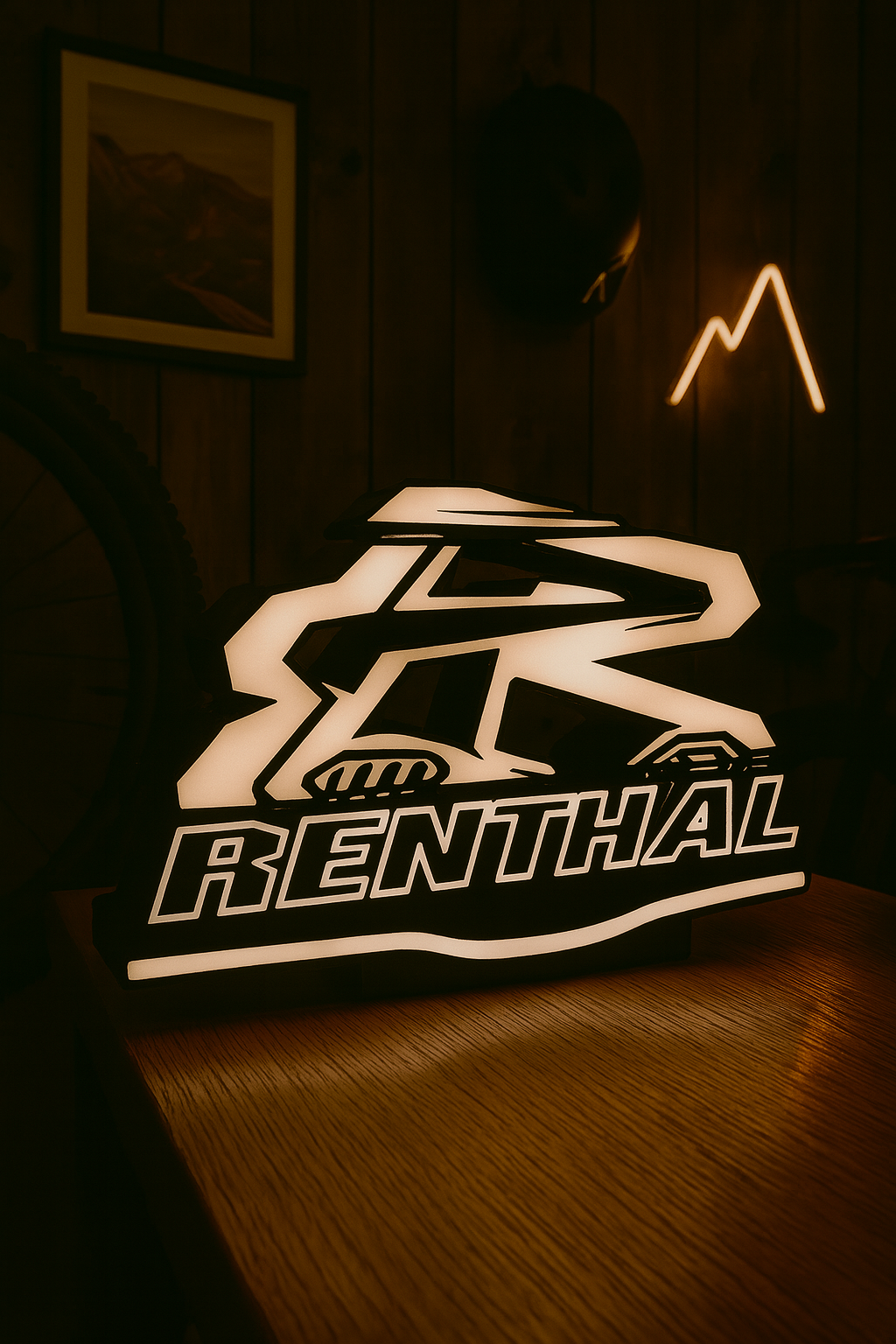 Illuminated Renthal light box glowing red and white logo